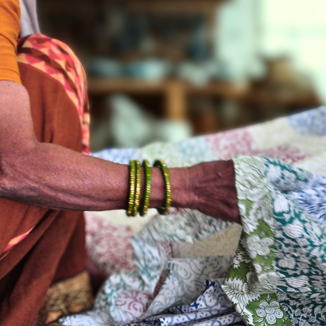 Woman holding upcycled fabric ready for sewing
