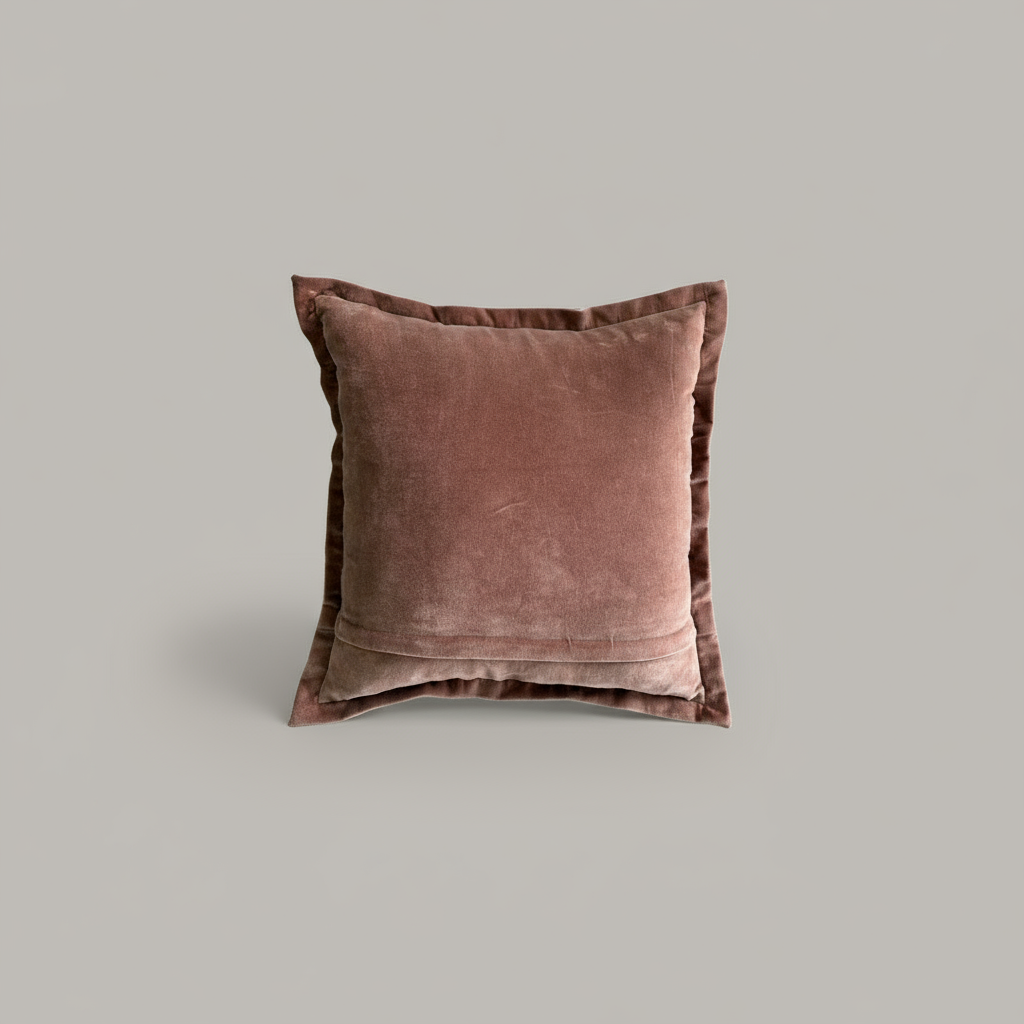 Pinkish sand velvet pillow on a light gray background