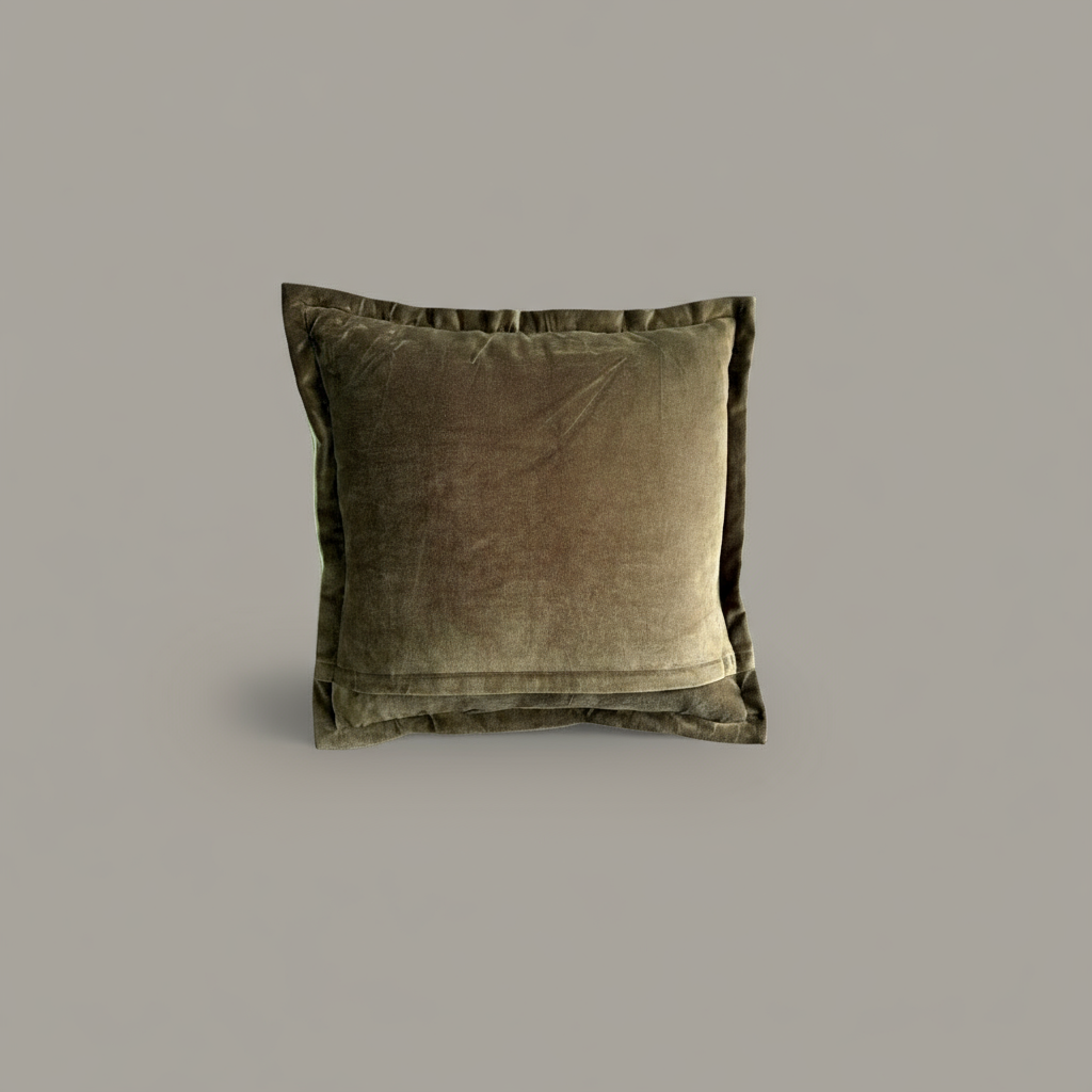 Olive velvet pillow on a gray background