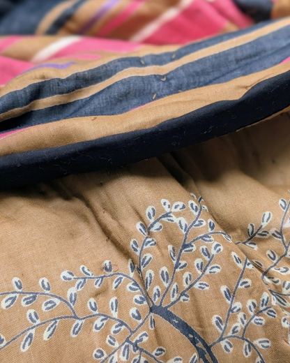 Close-up of Ochre Hand screen printed fabric with tree pattern and striped design