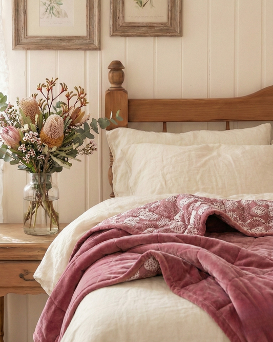 Sand drift dabu block printed reversible cotton velvet quilt  in a sundrenched bedroom